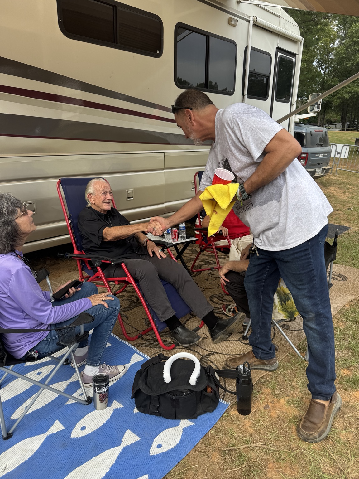 B. Douglas greeting Charlie Musselwhite after performing in Mississippi in 2026